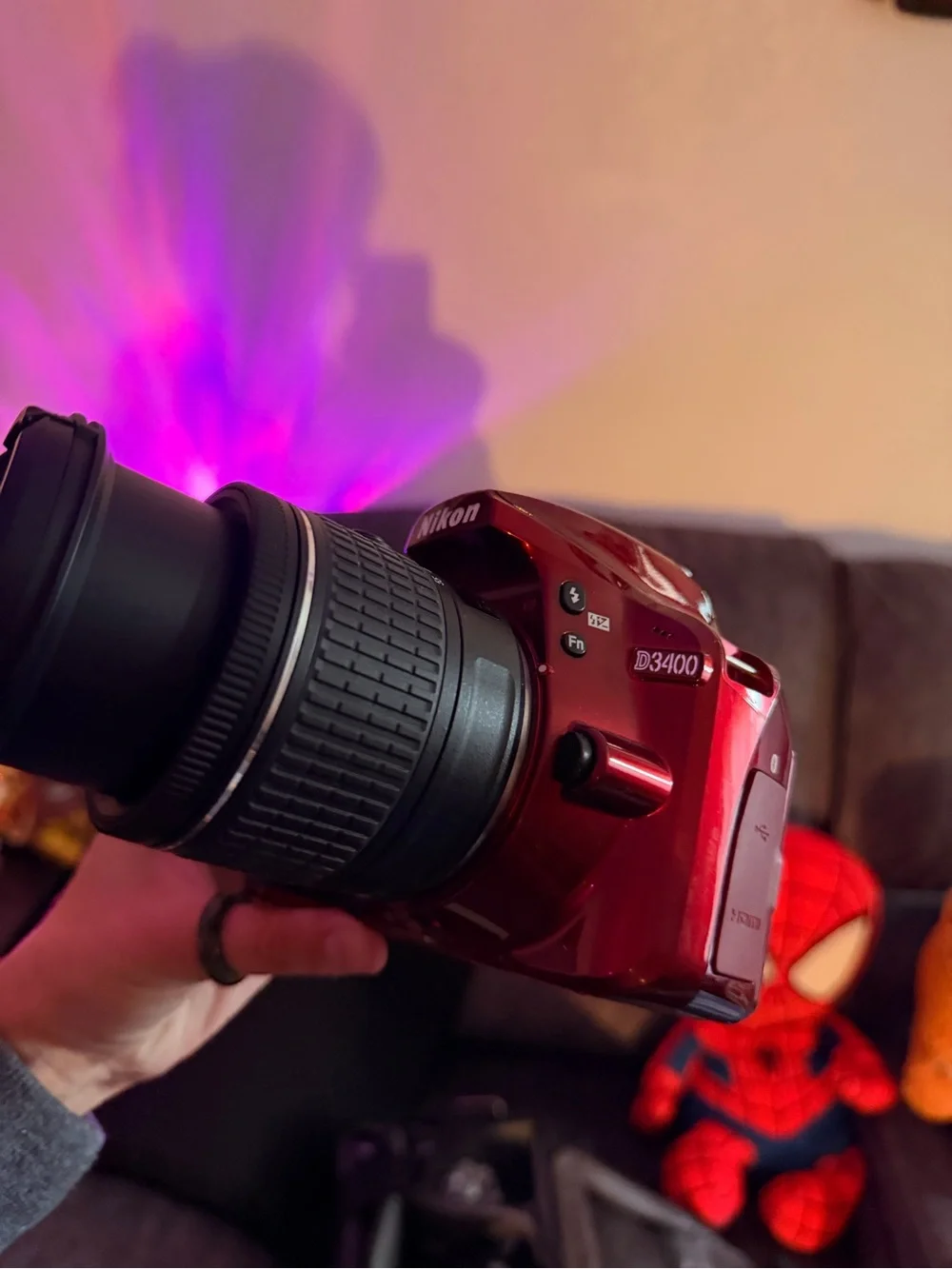 Nikon red DSLR with Nikon lens cap
